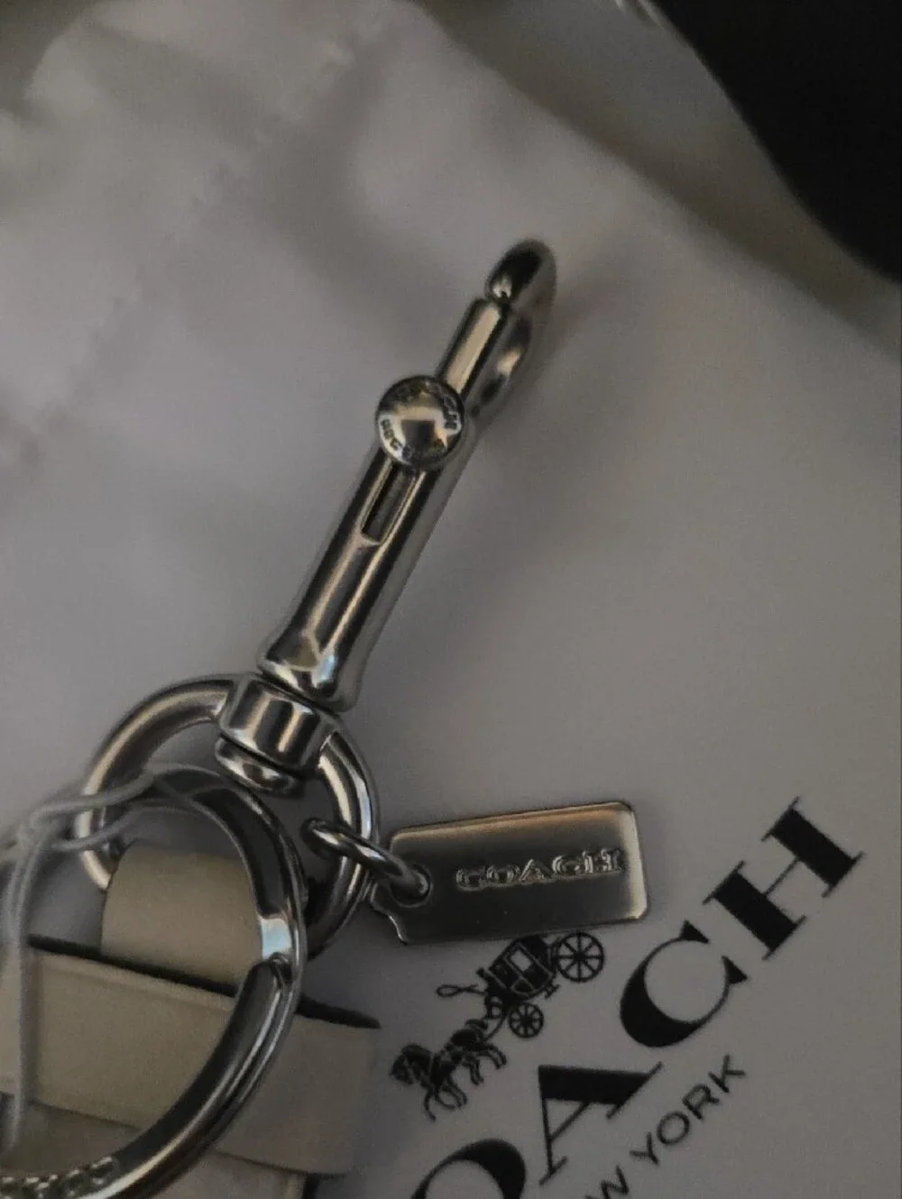 Coach Silver Leather Turn-Lock Keychain